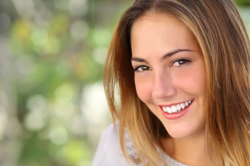 Smiling woman with natural-looking, even front teeth