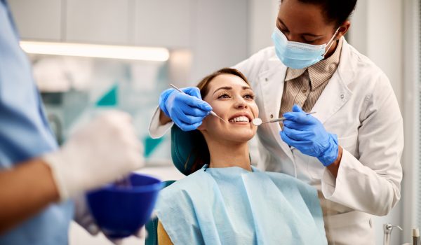 Young smiling woman having dental exam at dentist 2024 12 13 22 13 38 utc